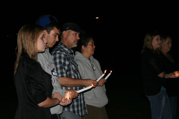 Friends and family of John Huntwork listened to stories about the 20-year-old Bremerton man during a candlelight memorial at Evergreen Park last Saturday. He died last July.