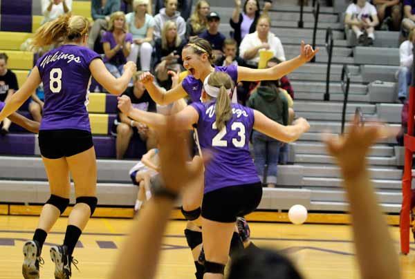 North Kitsap's Briar Perez and the Viking varsity volleyball team celebrate a point during the home match against the Kingston High School Buccaneers. The Vikings won 3-0.