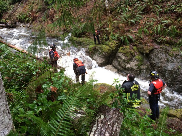 Fire crews gauge the waters of Big Beef Creek