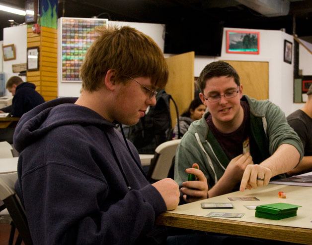 Tristan Lewis and Alex Morris play “Magic: The Gathering” at Discordia Games in West Bremerton Sunday. Discordia Games hosts Pokémon games on Wednesday nights.