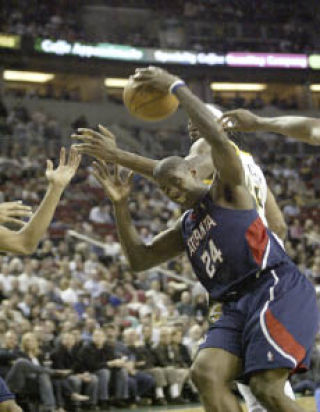 Marvin Williams fights for the ball against the Sonics at Key Arena Jan. 25. Williams is now a four-year NBA player.