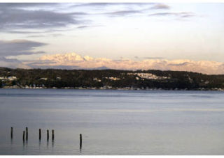 The snow-covered Brothers Mountains rise above Dyes Inlet.