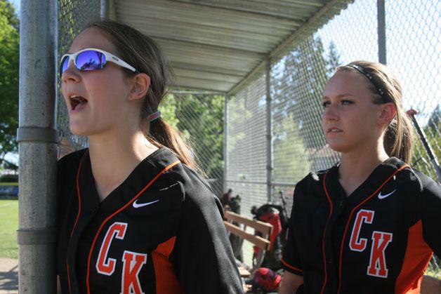 Central Kitsap players chear from the dugout during the game against Bainbridge Monday. The Cougars lost to Bainbridge during both contests this year.