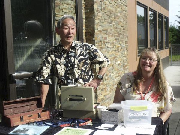 Cliff Higashi and Dena Barrios help with a past Greendrinks event.