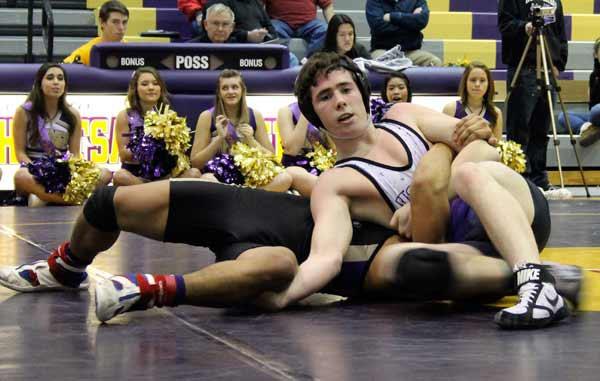 North Kitsap's John Morgan works toward a win over Sequim's Joel Allen Jan. 23 in the North Kitsap High School Gymnasium. Morgan pinned Allen