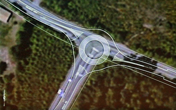 This county graphic shows the roundabout plan laid atop an image of the existing intersection of Seabeck Highway and Holly Road.