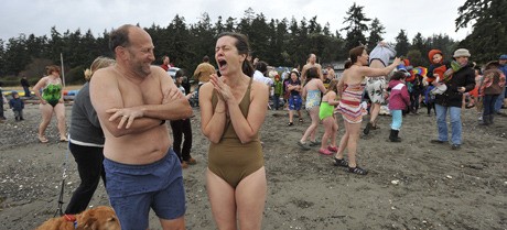 More than 100 swimmers braved the cold waters off Bainbridge's Pleasant Beach to ring in the New Year.