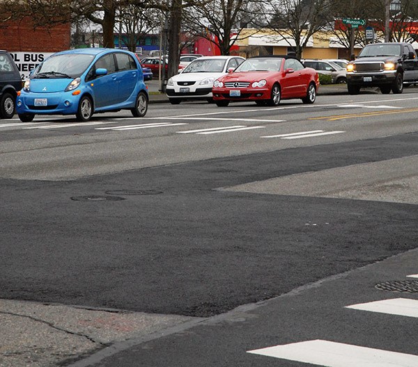 Asphalt patches cover parts of the intersection of Silverdale Way and Anderson Hill Road on Jan. 6.