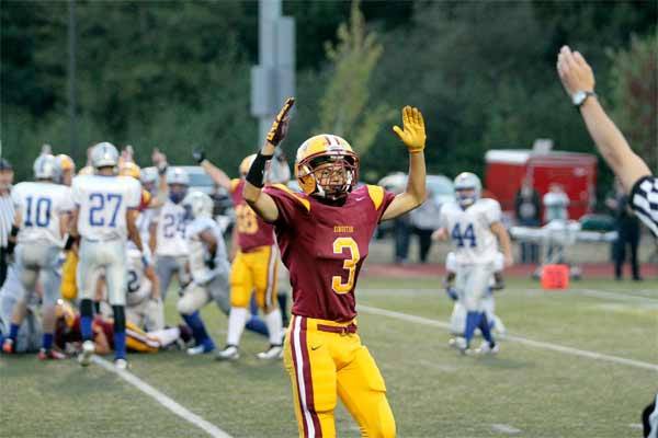 Kingston High School junior defensive back and wide receiver We-Laka Chiquiti celebrates the varsity football team's first