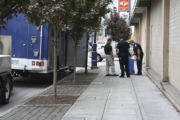 Bremerton Police officers inspect a large