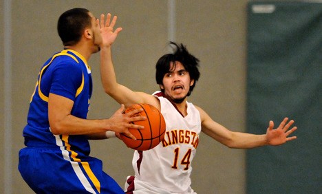 Kingston High School's Aaron Lawrence blocks against Fife during playoff action at Foss HS in Tacoma. Kingston lost to Fife 52-43. They play North Mason 6 p.m. Thursday at Foss