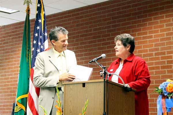 Poulsbo Mayor Becky Erickson welcomed Western Washington University President Bruce Shepard with a few goodies July 17