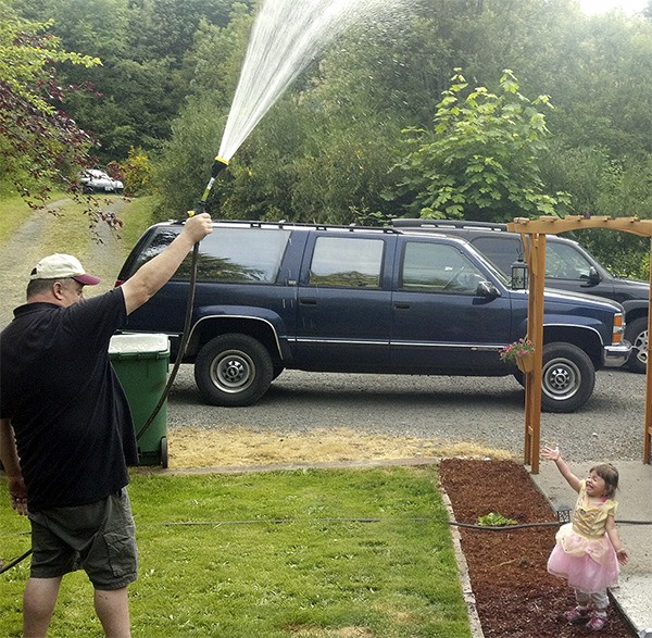 Robert May cools off his daughter