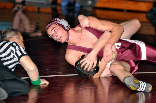 South Kitsap senior Josh Smeland pinned Central Kitsap's Kurt Koemmpel in 5:04 to help the Wolves to a 42-24 win Tuesday night in a Class 4A Narrows League dual match.