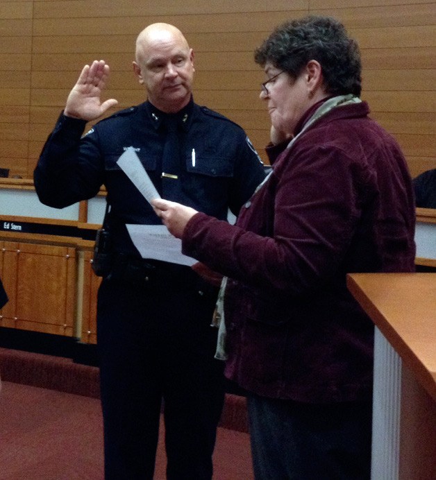 Bob Wright is sworn in as deputy chief of the Poulsbo Police Department by Mayor Becky Erickson in 2012.