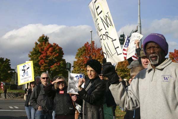 Residents all over Kitsap County gathered outside Bank of America in Silverdale to protest bank fees and economic inequality.