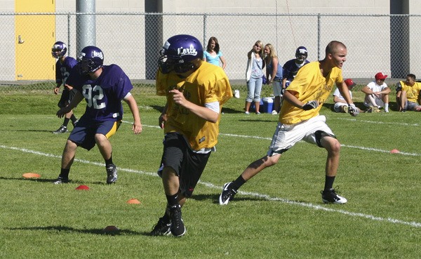 North Kitsap High School football players work on drills Wednesday at practice.