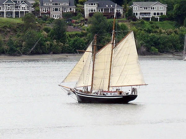 Workers will use the tidal grid at the Port of Poulsbo to replace the schooner Fiddlers Dream's masts. Fiddlers Dream will be the first schooner worked on in Poulsbo since 1954.