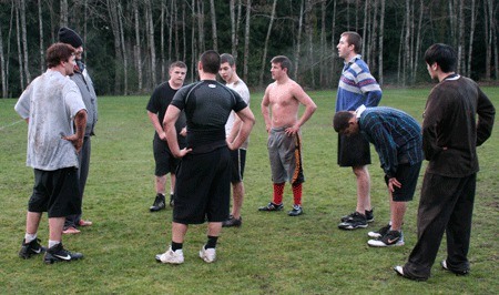 Members of the Kitsap Renegades U19 rugby team huddle during a practice Monday. The team does not have enough players to compete in sanctioned matches.