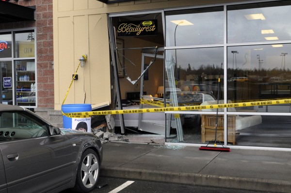 There were reportedly no injuries when an Audi crashed into the front of Sleep Country USA at College Marketplace in Poulsbo