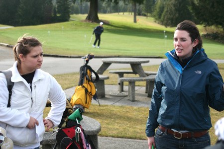 Bremerton High School girls golf coach Emily Crawford (right) holds practice Tuesday at Gold Mountain Golf Course.