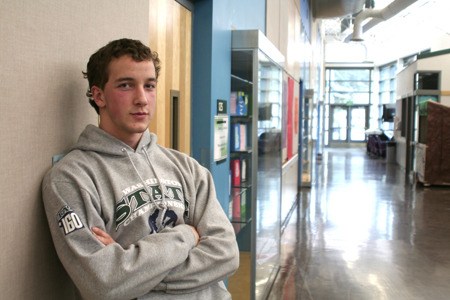 Klahowya Secondary School senior athlete Nehemiah Salo poses at the school last week before Eagles lacrosse practice. Salo plays three sports and won a state wrestling title last month.