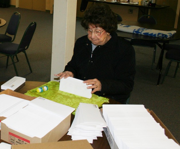Irene Brillhart stuffs envelopes for the Rescue Mission Oct. 26