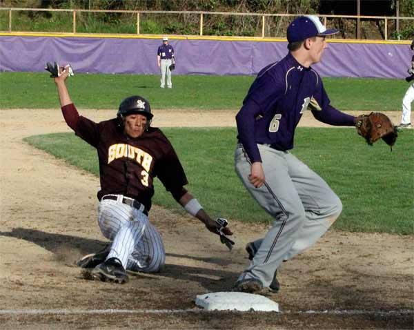 South Kitsap’s Nic Stoner slides into third base during the game against the North Kitsap Vikings April 10 at North Kitsap High School. The South Kitsap Wolves came back in the top of the seventh