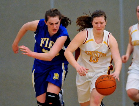 Kingston High guard Sophia Baetz dribbles past Fife's Ciara Pedroni Wednesday during the West Central District III tournament in Tacoma.