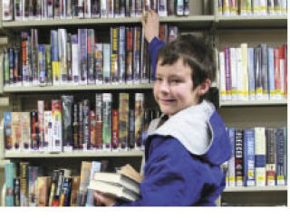 Silverdale resident Jacob Sheffield looks for books at the Silverdale branch of the Kitsap Regional Library.