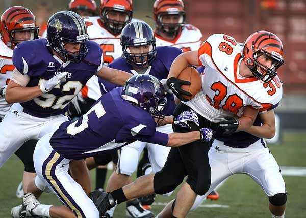 North Kitsap freshman Andrew Hecker (5) attempts to make the tackle on Centralia during home game action Sept. 9 at the North Kitsap Stadium.