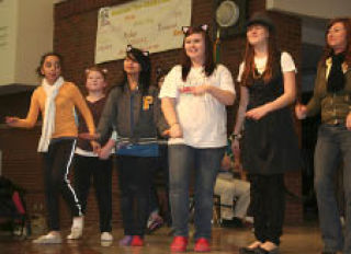 Members of the Mountain View Middle School choir try to stay in step as they prepare to perform the Disney musical