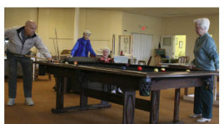 Seniors play pool at Canterbury Care Center in Bremerton. The facility is an Adult Day Services program.