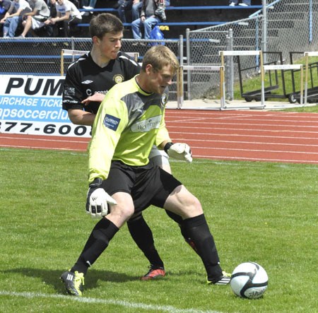 Kitsap Pumas goalkeeper Bryan Meredith guards the ball during the team’s home opener versus Victoria in Bremerton May 8.