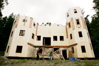 Home builder James Hauf (left) and helper Rod Wilker are constructing a 4