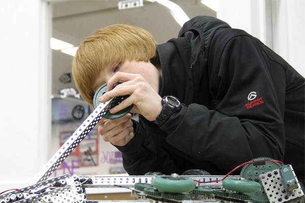 Darren Massey works on a robot for a three-day state technology competition