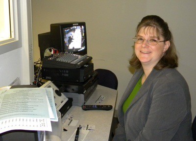 Deputy City Clerk Brandy Rinearson is learning how to run the camera in order to stream city council video online.