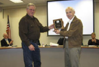 Central Kitsap Community Council then-president Jon Pearson honors past members at the January meeting: Carl Johnson