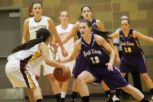 North Kitsap's Kristin Brown attempts to block Kingston's Aileen Kaye during the rivalry basketball game Jan. 28 in the Kingston High School Gymnasium.