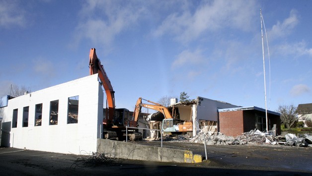 Excavators move rubble inside the former North Kitsap Armory Tuesday on Jensen Way in Poulsbo.