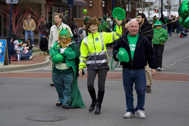 Bremerton Mayor Patty Lent waves to spectators as she makes her way down Pacific Avenue on Saturday as part of the city’s St. Patrick’s Day parade. The parade began at 10 a.m. and was followed by Irish festivities and entertainment.