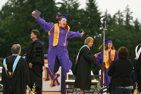 More than 390 students crossed the stage Friday night at North Kitsap High School's graduation ceremonies. Scott Breitbarth celebrates after receiving his diploma.