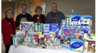 The Kitsap County Democratic Women (KCDW) held a “Women Helping Women” feminine hygiene products drive for the Central Kitsap Food Bank at their annual holiday party Dec. 12 at the Silverdale Beach Hotel. From left