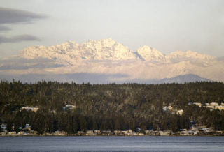 The snow-covered Brothers Mountains rise above Dyes Inlet.