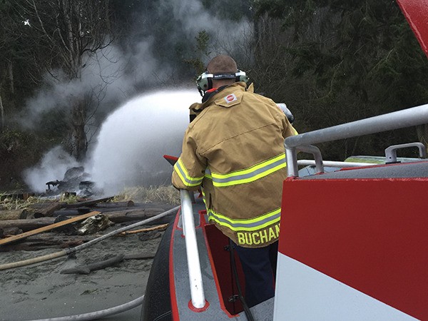 North Kitsap Fire & Rescue Lt. Ryan Buchanan uses one of the monitors (mounted nozzles capable of deploying as much as 1