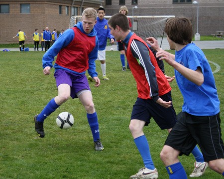 The Bremerton High School boys soccer team practices last week at home. The Knights are one red card away from being eliminated from the postseason under new guidelines set by the Washington Interscholastic Activities Association. The rule started for the spring 2011 season.