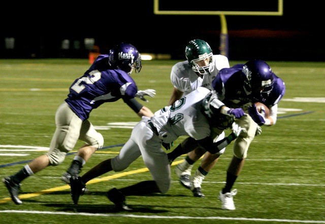 The Port Angeles Roughriders defense halts the Viking's offense during the first half of the homecoming game on Oct. 16.