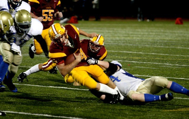 The Bremerton Knights do what they can against the Buccaneer offense on Oct. 15 during Kingston High's homecoming.