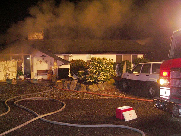 Central Kitsap Fire and Rescue firefighters respond to a two-story structure fire in Silverdale on Feb. 16.