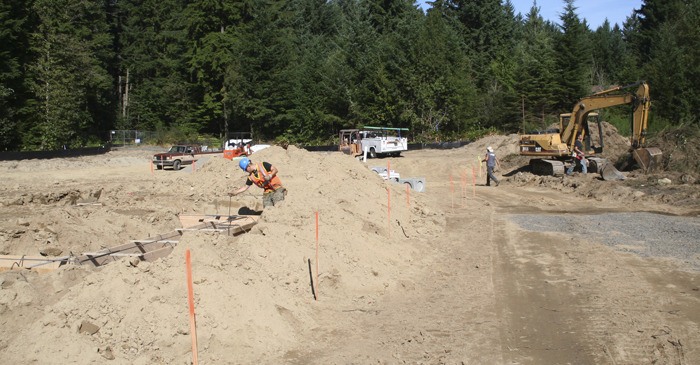 A worker sets forms Tuesday for the foundation of a building on Jackson Avenue in Port Orchard that will be the South Kitsap center for services provided by Kitsap Community Resources.